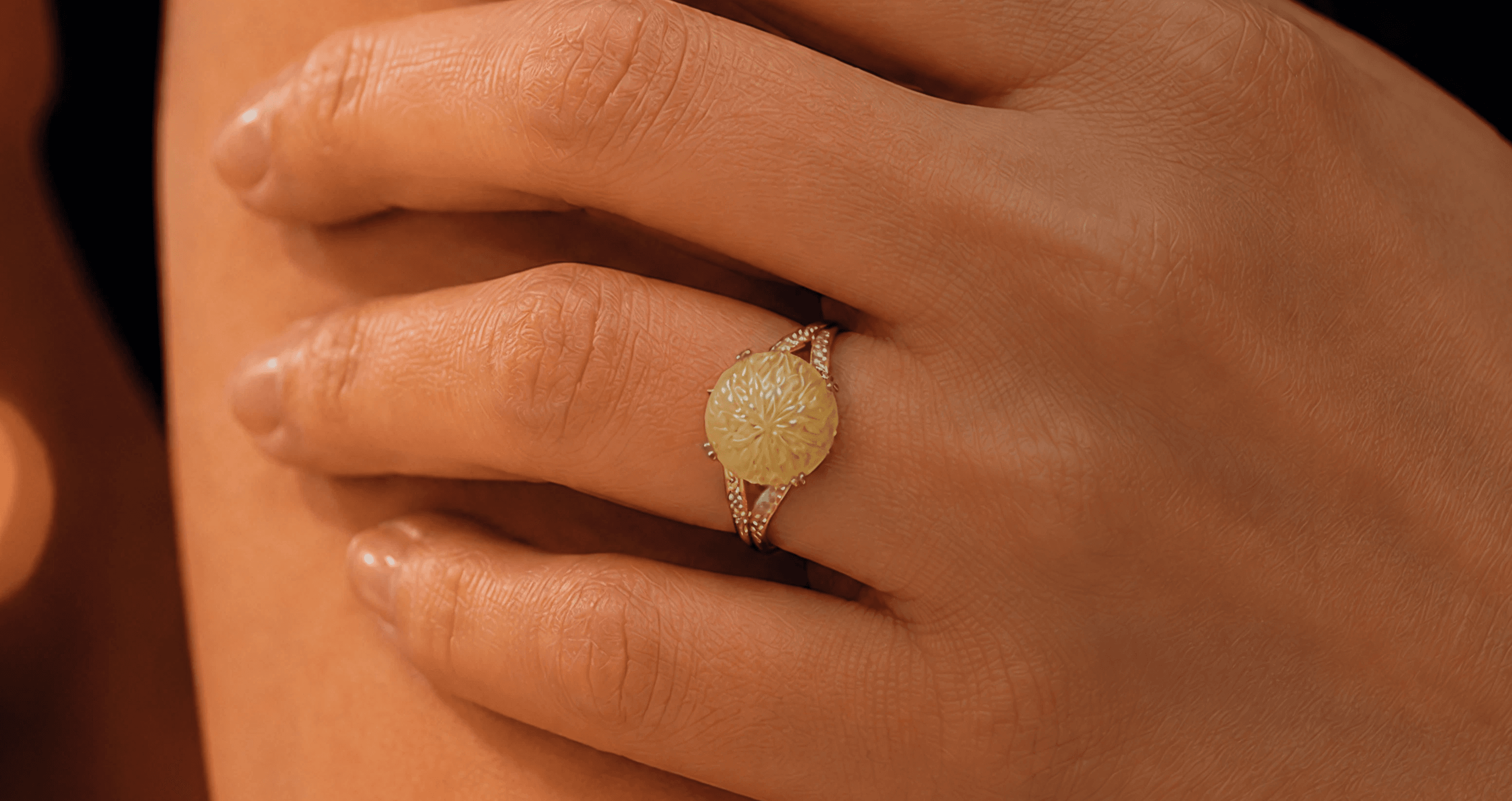 Fine jewelry held in warm evening light